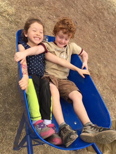 Maile and her friend Aiden haven't quite figured out the wheel barrow...