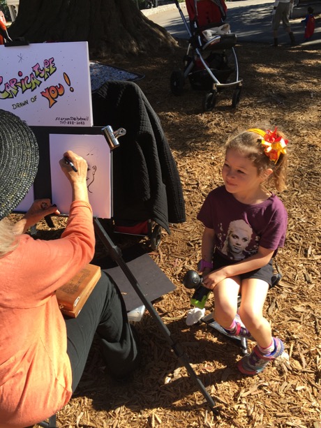Maile was very excited to pose for the caricature artist...