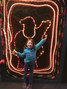 Maile Girl striking a pose with one of the many decorations...