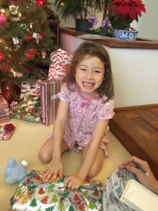Maile graciously pauses before diving in to her presents :)