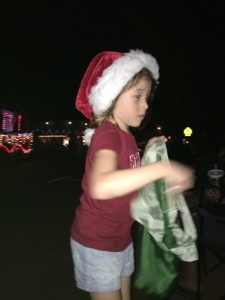 Maile Girl hard at work passing out candy as she walks the parade rout...