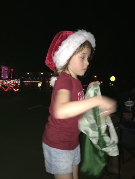 Maile Girl hard at work passing out candy as she walks the parade route...