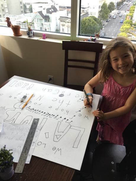 We then headed down to the store and picked up some poster board and Maile set to work translating her design to the poster board in pencil...