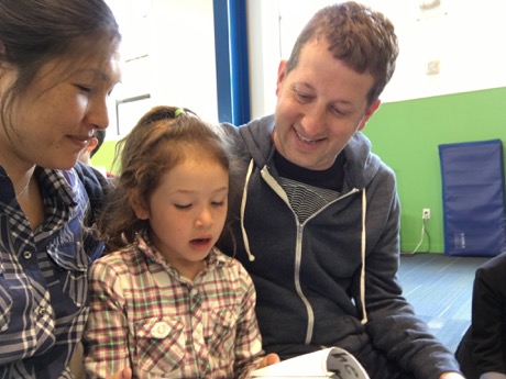 Reading to a very proud Mommy and Daddy :)