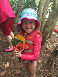 Maile showing off some of the pretty flowers she collected along the way...