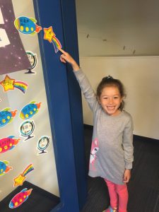 Finding her name on the 2nd Grade Blue door