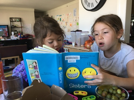 Sisters reading Sisters