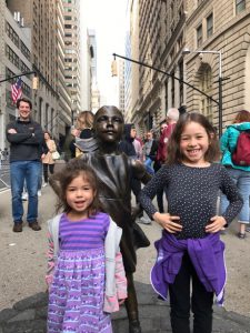 Maile and Lauren meet the Fearless Girl down near Wall Street